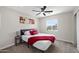 Cozy bedroom with a queen bed and red throw blanket at 1010 E Indianola Ave, Phoenix, AZ 85014