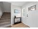 Inviting entryway with stairs and a stylish console table at 1010 E Indianola Ave, Phoenix, AZ 85014