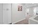 Bright hallway with access to bedrooms and linen closet at 1010 E Indianola Ave, Phoenix, AZ 85014