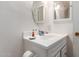 Clean bathroom with vanity, sink, and mirror at 10518 W Oakmont Dr, Sun City, AZ 85351