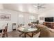 Small dining area with glass table and kitchen access at 10518 W Oakmont Dr, Sun City, AZ 85351