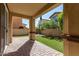 Covered patio opens to a grassy backyard with artificial turf at 1059 W Caroline Ln, Tempe, AZ 85284