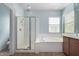 Bathroom with shower, tub, and double vanity at 1059 W Caroline Ln, Tempe, AZ 85284