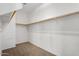 Large walk-in closet with double hanging rods at 1059 W Caroline Ln, Tempe, AZ 85284