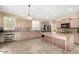 Eat-in kitchen with granite countertops and wood cabinets at 1059 W Caroline Ln, Tempe, AZ 85284