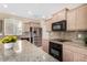 Modern kitchen with stainless steel appliances and granite at 1059 W Caroline Ln, Tempe, AZ 85284