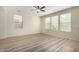 Bright living room with hardwood floors and large windows at 1059 W Caroline Ln, Tempe, AZ 85284