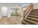 Open living area with light wood-look flooring and archways at 1059 W Caroline Ln, Tempe, AZ 85284