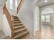 Staircase with wooden railing and carpeted steps at 1059 W Caroline Ln, Tempe, AZ 85284