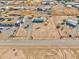 Aerial view of a house and surrounding desert landscape at 10991 W Hilltop Dr, Casa Grande, AZ 85193