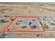 Aerial view of a manufactured home on a spacious lot near a highway at 10991 W Hilltop Dr, Casa Grande, AZ 85193