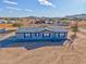 Single-level manufactured home with a large yard, situated on a spacious lot at 10991 W Hilltop Dr, Casa Grande, AZ 85193