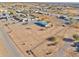 Aerial view of a single-Gathering home on a large lot with surrounding desert landscape at 10991 W Hilltop Dr, Casa Grande, AZ 85193