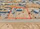 Aerial view highlighting a manufactured home's large lot and desert surroundings at 10991 W Hilltop Dr, Casa Grande, AZ 85193