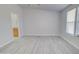 Spacious bedroom with light gray vinyl flooring and an ensuite bathroom at 10991 W Hilltop Dr, Casa Grande, AZ 85193