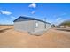 Side view of a manufactured home, showing a modern exterior design at 10991 W Hilltop Dr, Casa Grande, AZ 85193