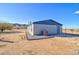 Side view of manufactured home with landscaping and mountain views at 10991 W Hilltop Dr, Casa Grande, AZ 85193