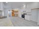 Modern kitchen features white cabinets, granite countertops, and stainless steel appliances at 10991 W Hilltop Dr, Casa Grande, AZ 85193