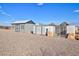 Gray storage shed with double doors and windows at 10991 W Hilltop Dr, Casa Grande, AZ 85193