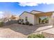 Landscaped backyard with flagstone patio at 1154 W Lowell Dr, San Tan Valley, AZ 85140