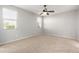 Bright bedroom with ceiling fan and neutral carpeting at 1154 W Lowell Dr, San Tan Valley, AZ 85140