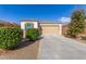 Single-story home with two-car garage and well-manicured landscaping at 1154 W Lowell Dr, San Tan Valley, AZ 85140