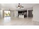 Open living area with kitchen, island and ceiling fans at 1154 W Lowell Dr, San Tan Valley, AZ 85140