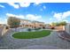 Landscaped backyard with a kidney-shaped pool and gravel at 12503 S 175Th Ave, Goodyear, AZ 85338