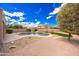 Backyard featuring a pool, desert landscaping, and a paved patio area at 12503 S 175Th Ave, Goodyear, AZ 85338