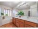 Bathroom features double sinks, a bathtub, and wood cabinets at 12503 S 175Th Ave, Goodyear, AZ 85338