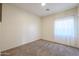 Simple bedroom with a window and carpet at 12503 S 175Th Ave, Goodyear, AZ 85338