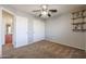 Bedroom with ceiling fan and double door closet at 12503 S 175Th Ave, Goodyear, AZ 85338