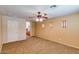 Primary bedroom with ceiling fan and multiple windows at 12503 S 175Th Ave, Goodyear, AZ 85338