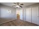 Bedroom with ceiling fan and double door closet at 12503 S 175Th Ave, Goodyear, AZ 85338