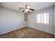 Bright bedroom with ceiling fan and carpet flooring at 12503 S 175Th Ave, Goodyear, AZ 85338