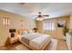 Bright and inviting main bedroom with modern decor, neutral tones, and ample natural light at 12503 S 175Th Ave, Goodyear, AZ 85338