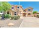 Two-story house with a beige facade and landscaping at 12503 S 175Th Ave, Goodyear, AZ 85338