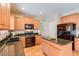 Eat-in kitchen with granite countertops and black appliances at 12503 S 175Th Ave, Goodyear, AZ 85338