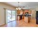 Kitchen with island, granite countertops, and wood cabinets at 12503 S 175Th Ave, Goodyear, AZ 85338