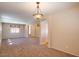 Open living room with hardwood floors and a chandelier at 12503 S 175Th Ave, Goodyear, AZ 85338