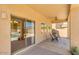 Covered patio with sliding glass doors and pool view at 12503 S 175Th Ave, Goodyear, AZ 85338