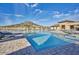 Community pool with lounge chairs and mountain views at 12503 S 175Th Ave, Goodyear, AZ 85338