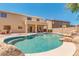 Inviting kidney-shaped pool with rock waterfall feature at 12503 S 175Th Ave, Goodyear, AZ 85338