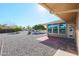 Backyard view with patio, gravel, and trees at 12619 N Sun Valley Dr, Sun City, AZ 85351