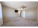 Bright bedroom with ceiling fan and carpeting at 12619 N Sun Valley Dr, Sun City, AZ 85351