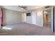 Bright bedroom with carpet flooring and access to bathroom at 12619 N Sun Valley Dr, Sun City, AZ 85351