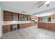 Open concept kitchen with island and built-in desk area at 12619 N Sun Valley Dr, Sun City, AZ 85351