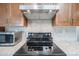 Stainless steel range and microwave in updated kitchen at 12619 N Sun Valley Dr, Sun City, AZ 85351