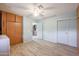 Bright laundry room with tile flooring and access to kitchen at 12619 N Sun Valley Dr, Sun City, AZ 85351