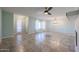 Open living room and dining area with tile flooring and ceiling fan at 12619 N Sun Valley Dr, Sun City, AZ 85351